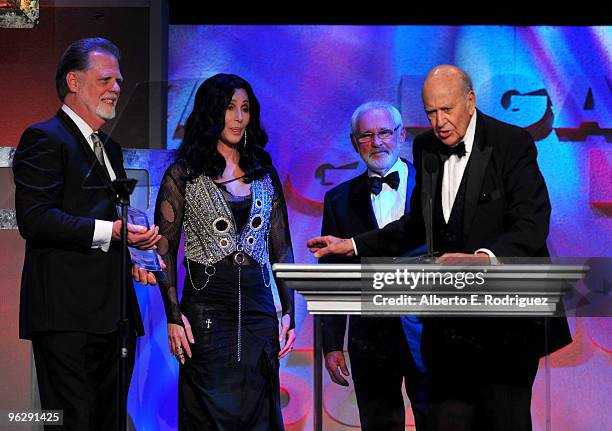 President Taylor Hackford, singer Cher, Director Norman Jewison, recipient of the Lifetime Achievement Award and host Carl Reiner speak onstage...