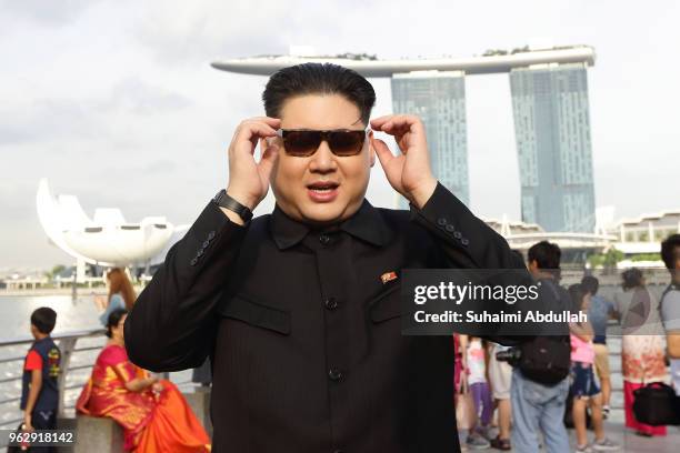 Kim Jong Un impersonator, Howard X, makes an appearance at Merlion Park on May 27, 2018 in Singapore. The proposed North Korea-United States summit...