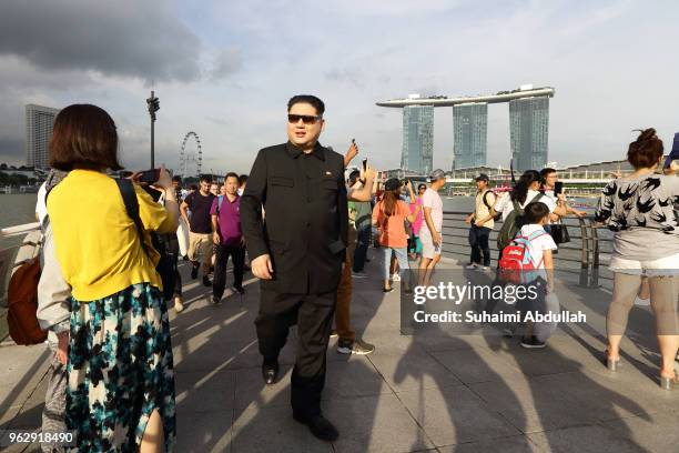 Kim Jong Un impersonator, Howard X, makes an appearance at Merlion Park on May 27, 2018 in Singapore. The proposed North Korea-United States summit...
