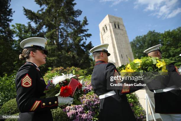 Marines carry wreaths during a ceremony to commemorate the 100th anniversary of the World War I Battle of Belleau Wood on Memorial Day at the...