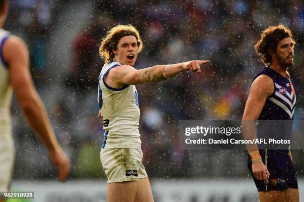 Ben Brown of the Kangaroos directs his teammates during the 2018 AFL round 10 match between the Fremantle Dockers and the North Melbourne Kangaroos...