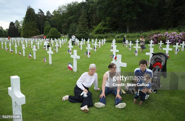 French family sits among the graves of U.S. Soldiers, most of them killed in the World War I Battle of Belleau Wood, during a ceremony to commemorate...