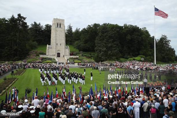 Visitors look on as U.S. Marines and French and German soldiers commemorate the 100th anniversary of the World War I Battle of Belleau Wood on...