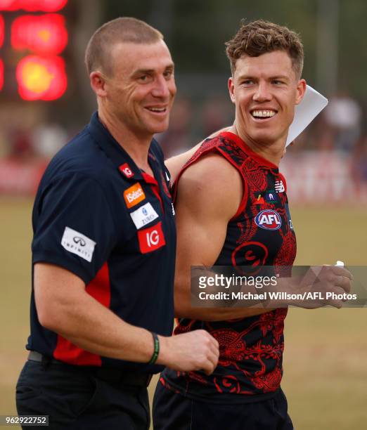 Simon Goodwin, Senior Coach of the Demons and Jake Melksham of the Demons celebrate during the 2018 AFL round 10 match between the Melbourne Demons...