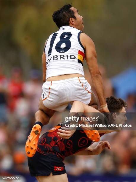 Eddie Betts of the Crows attempts to mark over Jake Lever of the Demons during the 2018 AFL round 10 match between the Melbourne Demons and the...