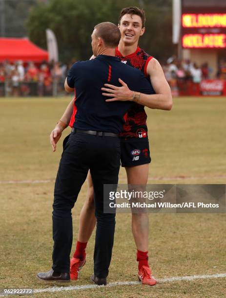 Simon Goodwin, Senior Coach of the Demons and Jake Lever of the Demons during the 2018 AFL round 10 match between the Melbourne Demons and the...