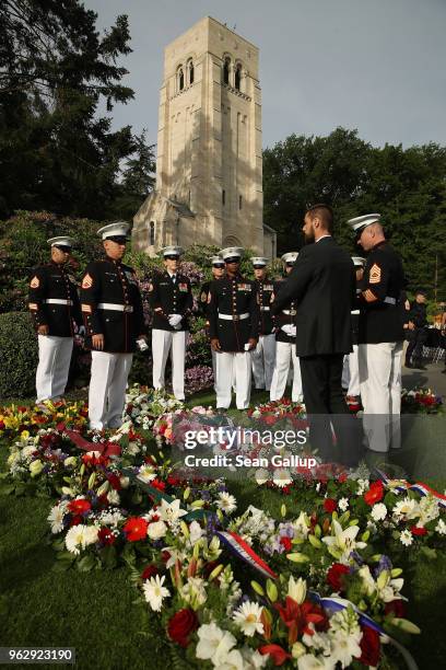 Marines discuss their choreography prior to a ceremony to commemorate the 100th anniversary of the World War I Battle of Belleau Wood on Memorial Day...