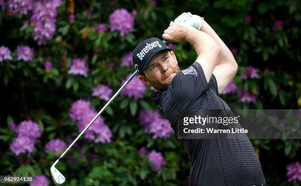 Branden Grace of South Africa tees off on the 7th hole during day four and the final round of the BMW PGA Championship at Wentworth on May 27, 2018...