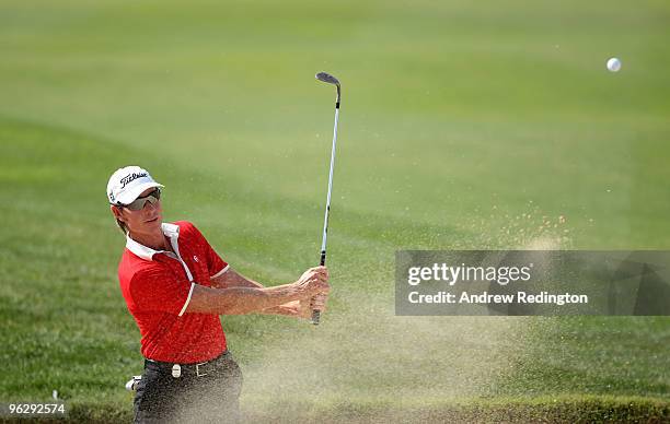 Brett Rumford of Australia plays a bunker shot on the sixth hole during the final round of the Commercialbank Qatar Masters at Doha Golf Club on...