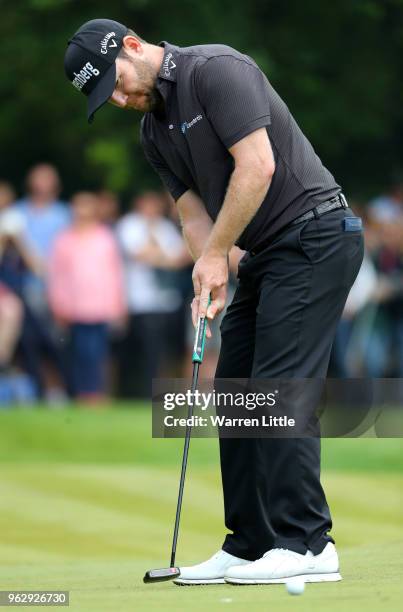 Branden Grace of South Africa putts on the 6th green during day four and the final round of the BMW PGA Championship at Wentworth on May 27, 2018 in...