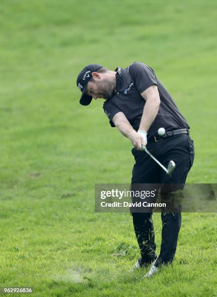 Branden Grace of South Africa plays his second shot on the par 4, first hole during the final round of the 2018 BMW PGA Championship on the West...