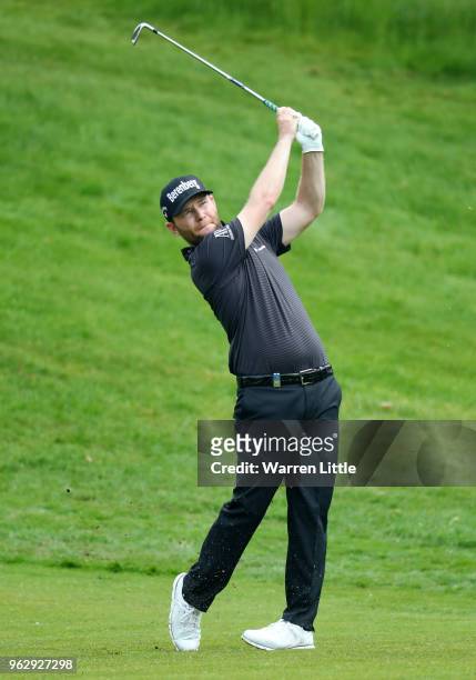 Branden Grace of South Africa plays his second shot on the 7th hole during day four and the final round of the BMW PGA Championship at Wentworth on...