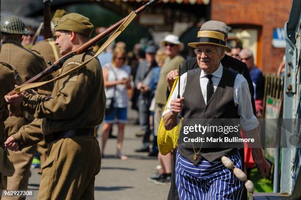 Re-enactors as the cast of the hit TV Series Dad's Army greet a train stopping at the platform on May 27, 2018 in Weybourne, England. The North...