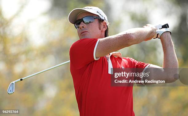 Brett Rumford of Australia hits his tee-shot on the third hole during the final round of the Commercialbank Qatar Masters at Doha Golf Club on...