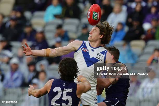 Ben Brown of the Kangaroos attempts an overhead mark during the round 10 AFL match between the Fremantle Dockers and the North Melbourne Kangaroos at...