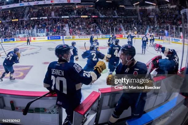 Emil Oksanen of Regina Pats fist bumps a teammate as the buzzer indicates the end of the game and the game 1 win against the Hamilton Bulldogs at...