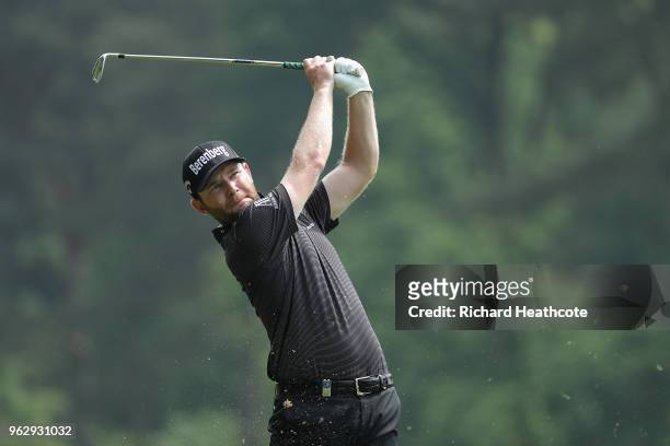 Branden Grace of South Africa hits his second shot on the 9th hole during the final round of the BMW PGA Championship at Wentworth on May 27, 2018 in...