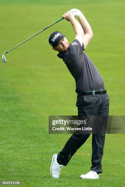 Branden Grace of South Africa plays his second shot on the 4th hole during day four and the final round of the BMW PGA Championship at Wentworth on...