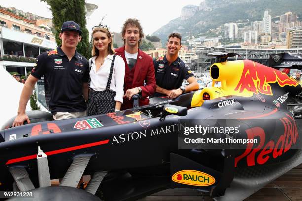 Albert Hammond Jr and his wife Justyna Hammond Jr pose for a photo with Daniel Ricciardo of Australia and Red Bull Racing and Max Verstappen of...