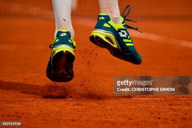 Detail of the shoes of France's Maxime Janvier as he serves to Japan's Kei Nishikori during their men's singles first round match on day one of The...