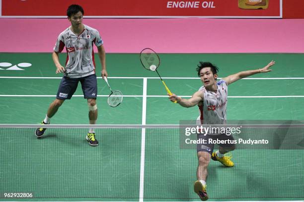 Yuta Watanabe and Keigo Sonoda of Japan compete against Li Junhui and Liu Yuchen of China during the Thomas Cup Final match on day eight of the BWF...