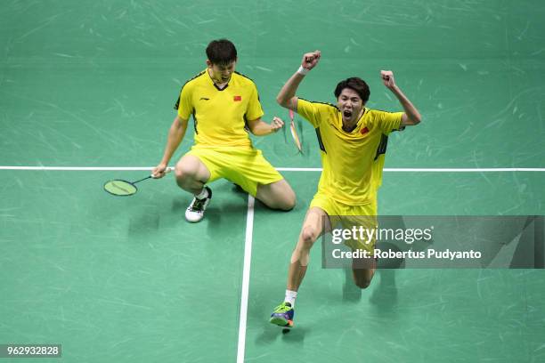 Li Junhui and Liu Yuchen of China celebrate victory after beating Yuta Watanabe and Keigo Sonoda of Japan during the Thomas Cup Final match on day...