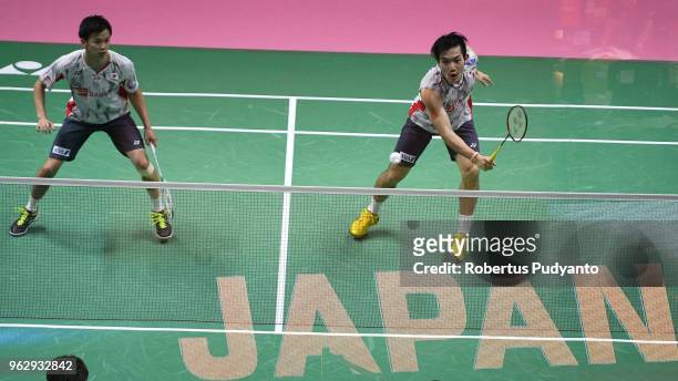 Yuta Watanabe and Keigo Sonoda of Japan compete against Li Junhui and Liu Yuchen of China during the Thomas Cup Final match on day eight of the BWF...