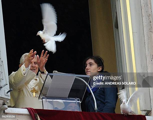 Pope Benedict XVI sets free a dove from the window of his apartment at the end of his Sunday Angelus prayer in St. Peter's square at the Vatican on...