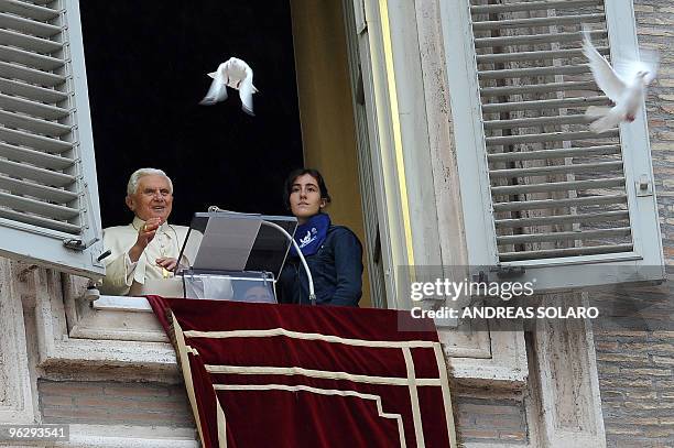 Pope Benedict XVI sets free a dove from the window of his apartment at the end of his Sunday Angelus prayer in St. Peter's square at the Vatican on...