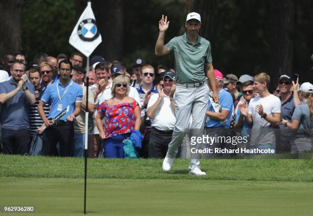 Ross Fisher of England chips in on the 10th hole during the final round of the BMW PGA Championship at Wentworth on May 27, 2018 in Virginia Water,...