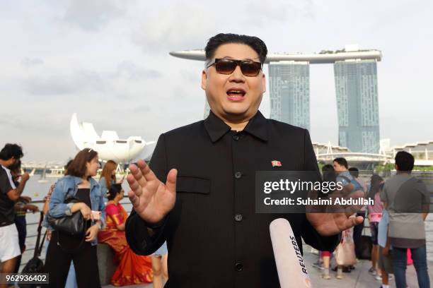 Kim Jong Un impersonator, Howard X gives an interview at Merlion Park on May 27, 2018 in Singapore. The proposed North Korea-United States summit...