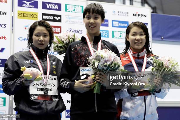 Winner Peng Xuwei of China celebrates with runner-up Sayaka Akase of Japan and third-placed Rio Shirai of Japan after the Women's 200m Backstroke...