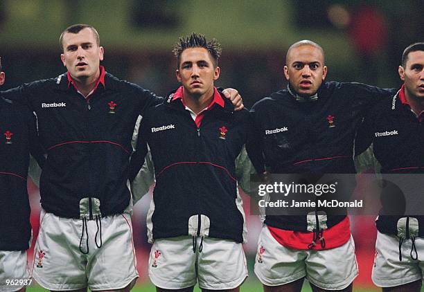 Geraint Lewis, Gavin Henson, and Gavin Thomas of Wales line-up for the national anthem before the International Friendly match against Romania played...