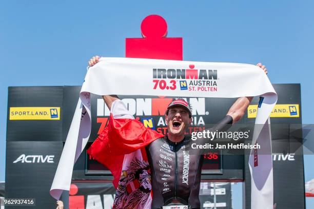 Michael Weiss of Austria reacts after winning the IRONMAN 70.3 St Polten on May 27, 2018 in Sankt Polten, Austria.
