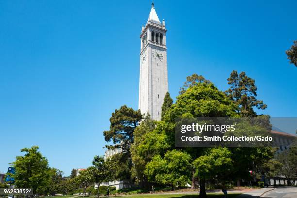 Campus buildings and Sather Tower, aka the Campanile, are visible among trees on a sunny day on the main campus of UC Berkeley in downtown Berkeley,...