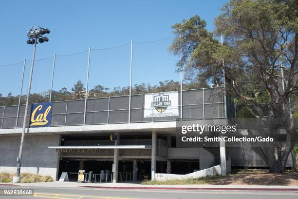 Parking area near California Memorial Stadium with logo for tailgating and for Cal sports teams on a sunny day on the main campus of UC Berkeley in...