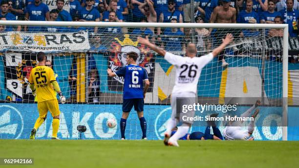 Connor Krempicki of Uerdingen scores his team's first goal past goalkeeper Markus Scholz of Mannheim during the Third League Playoff Leg 2 match...