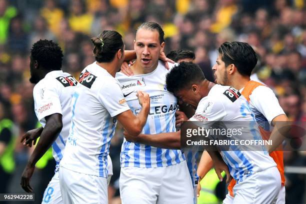 Zurich's Swiss forward Michael Frey celebrates with his teammates after scoring his team's first goal during the Swiss Football Cup final football...