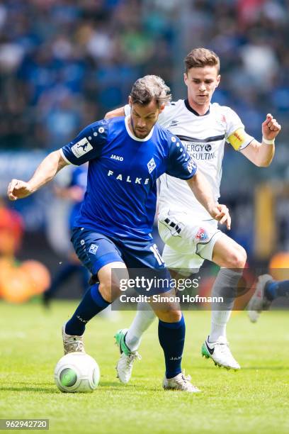 Patrick Mayer of Mannheim is challenged by Mario Erb of Uerdingen during the Third League Playoff Leg 2 match between SV Waldhof Mannheim and KFC...