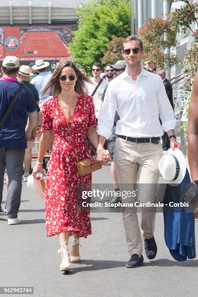 Pippa Middleton and James Matthews are seen in Roland Garros on May 27, 2018 in Paris, France.