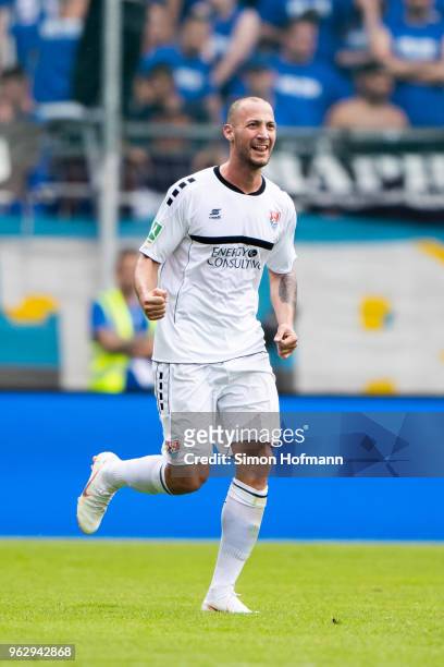 Tanju Oeztuerk of Uerdingen celebrates his team's second goal during the Third League Playoff Leg 2 match between SV Waldhof Mannheim and KFC...