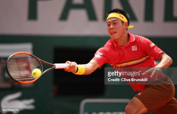 Kei Nishikori of Japan plays a forehand against Maxime Janvier of France in their first round mens singles match on day one of the French Open at...