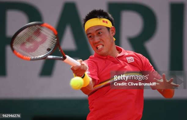 Kei Nishikori of Japan plays a forehand against Maxime Janvier of France in their first round mens singles match on day one of the French Open at...