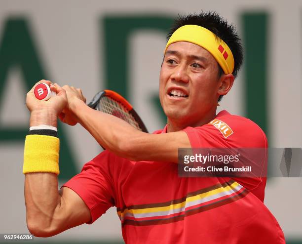 Kei Nishikori of Japan in action against Maxime Janvier of France in their first round mens singles match on day one of the French Open at Roland...