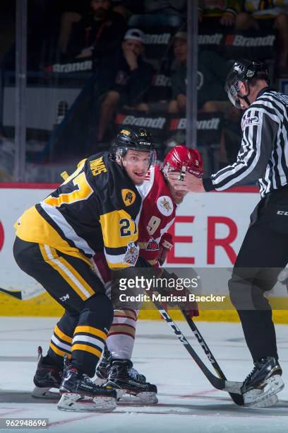 Robert Thomas of Hamilton Bulldogs checks Samuel L'Italien of Acadie-Bathurst Titan after the face off at Brandt Centre - Evraz Place on May 22, 2018...