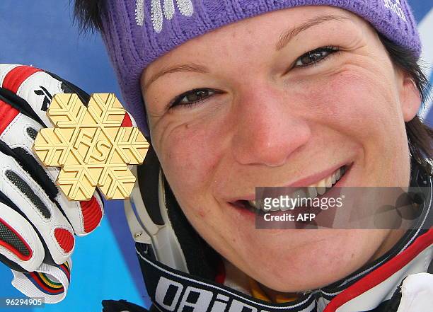 Germany's Maria Riesch poses with her gold medal of the women's slalom during the World Ski Championships on February 14, 2009 in Val d'Isere, French...