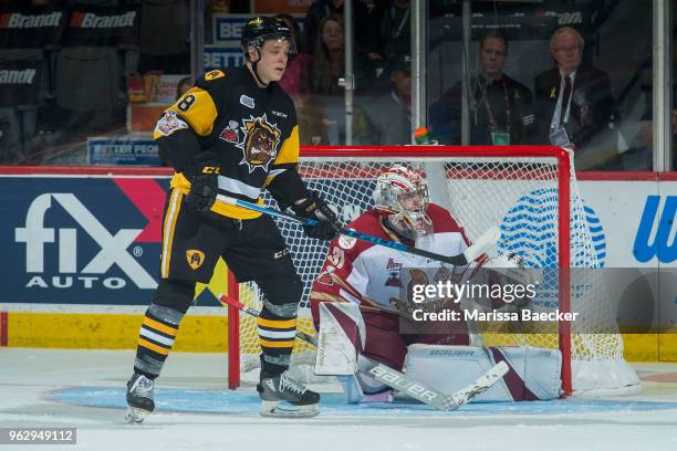 Matthew Strome of the Hamilton Bulldogs looks for the pass ahead of the net of Evan Fitzpatrick of Acadie-Bathurst Titan at Brandt Centre - Evraz...