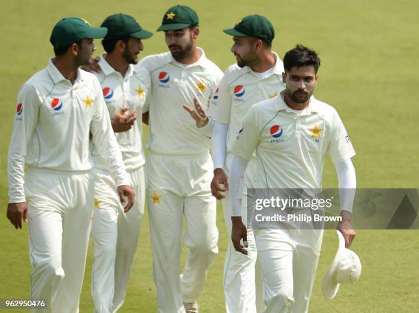 Mohammad Amir leaves the field during the fourth day of the 1st Natwest Test match between England and Pakistan at Lord's cricket ground on May 27,...