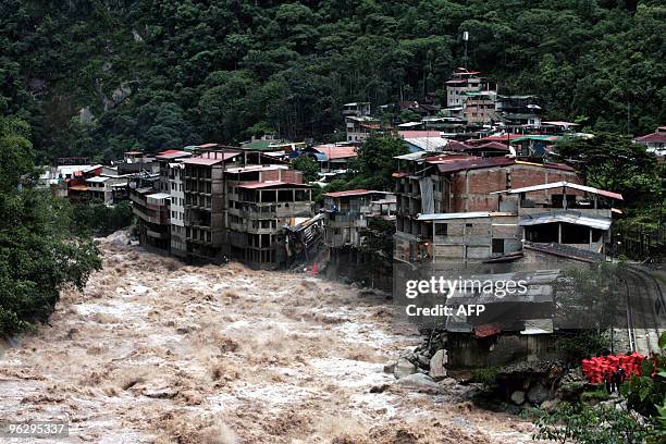 View of the village of Aguas Calientes with the flooded Vilcanota river, near Machu Picchu archaeological site in Cuzco, Peru on January 28, 2010....