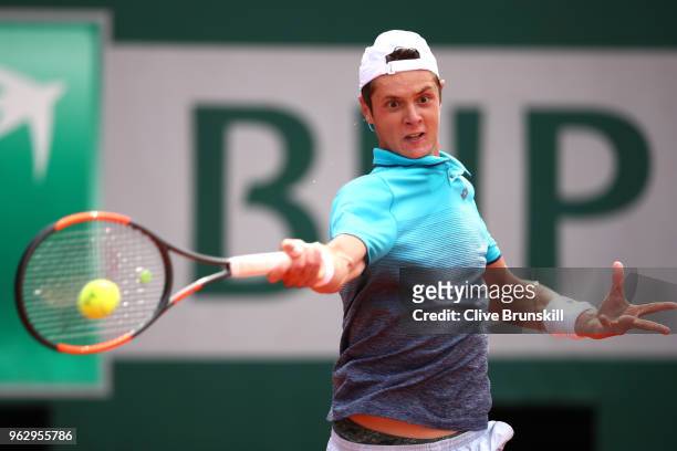 Maxime Janver of France plays a forehand during his mens singles first round match against Kei Nishikori of Japan during day one of the 2018 French...